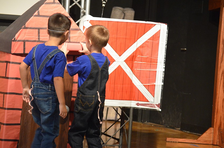 Francesco Guillermoni and Liam Hysell build their brick house in preparation for the wolf to attempt to blow their house down.