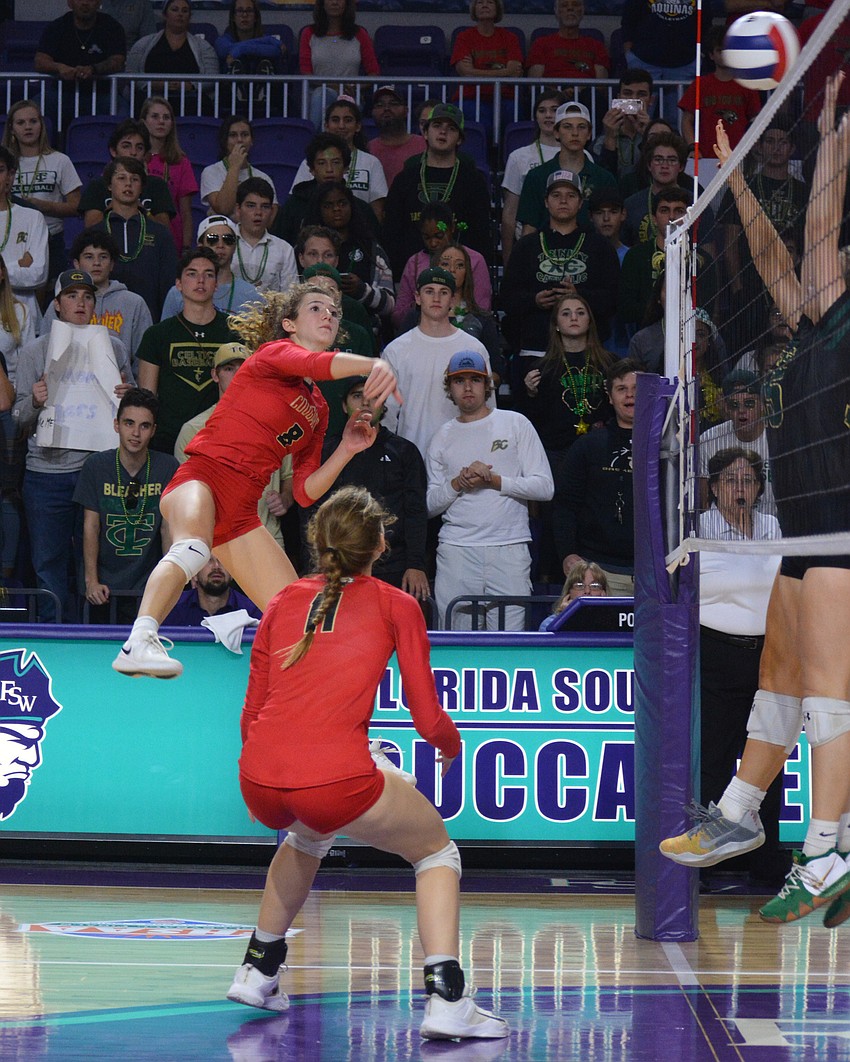 Cougars junior Sophia Hritz leaps for a kill attempt. She finished with 12 kills.