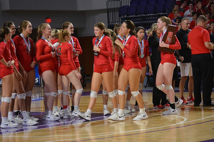 The Cougars stay on the court while senior Dalton Judge collects the state runner-up trophy.