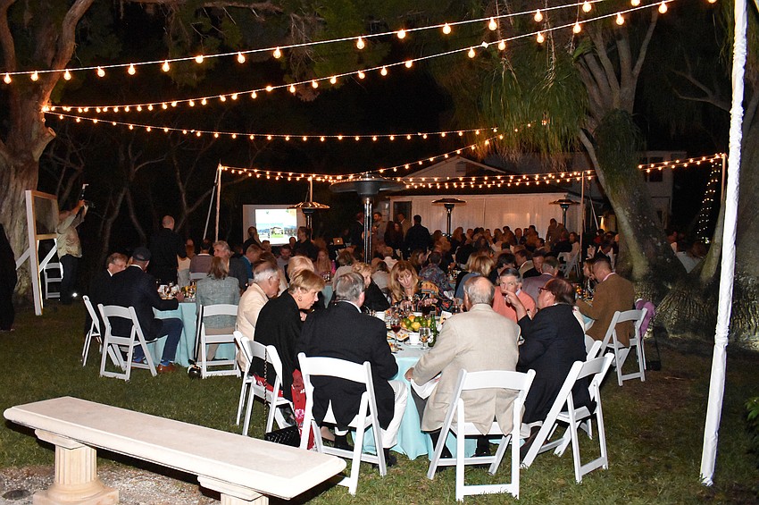 Guests dined under the stars on the lawn of Historic Spanish Point’s White Cottage.