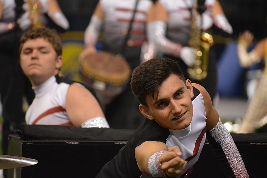 Junior Greg Elder has to show the emotion of the musical number because he and the rest of the percussion group are in the front row.