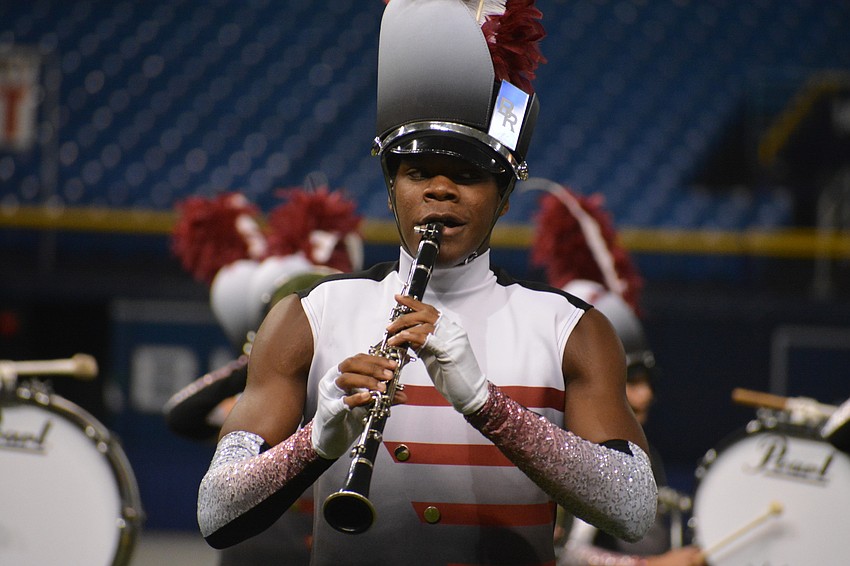 Junior Ben Williams marches with the rest of the clarinet section.
