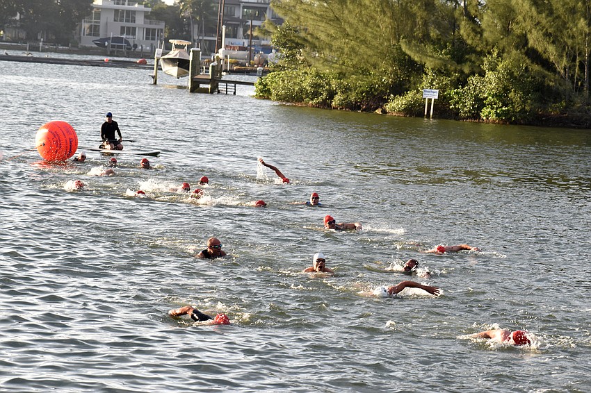 Following the swimming portion of the triathlon, racers biked then ran.