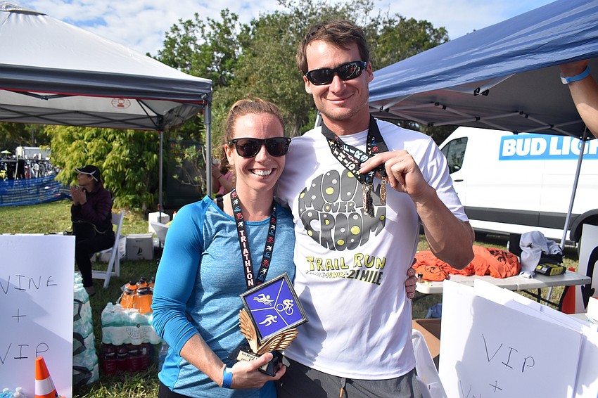 Brittney Sawhill, who won first place in the women’s sprint triathlon, and Calvin Serviss