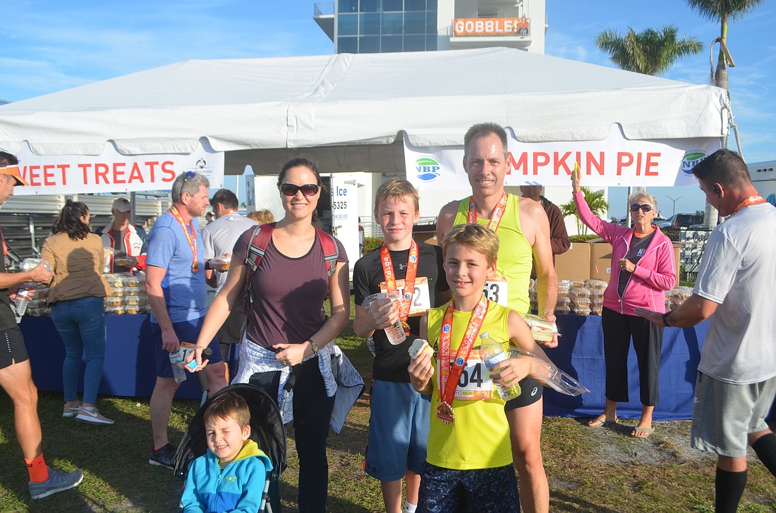 Sarasota&#39;s Jordan Page, 4, Wendy Page, Elijah Page, 11, Samuel Page, 9 and Keith Page just moved from South Africa and ran their first Turkey Trot as a family.