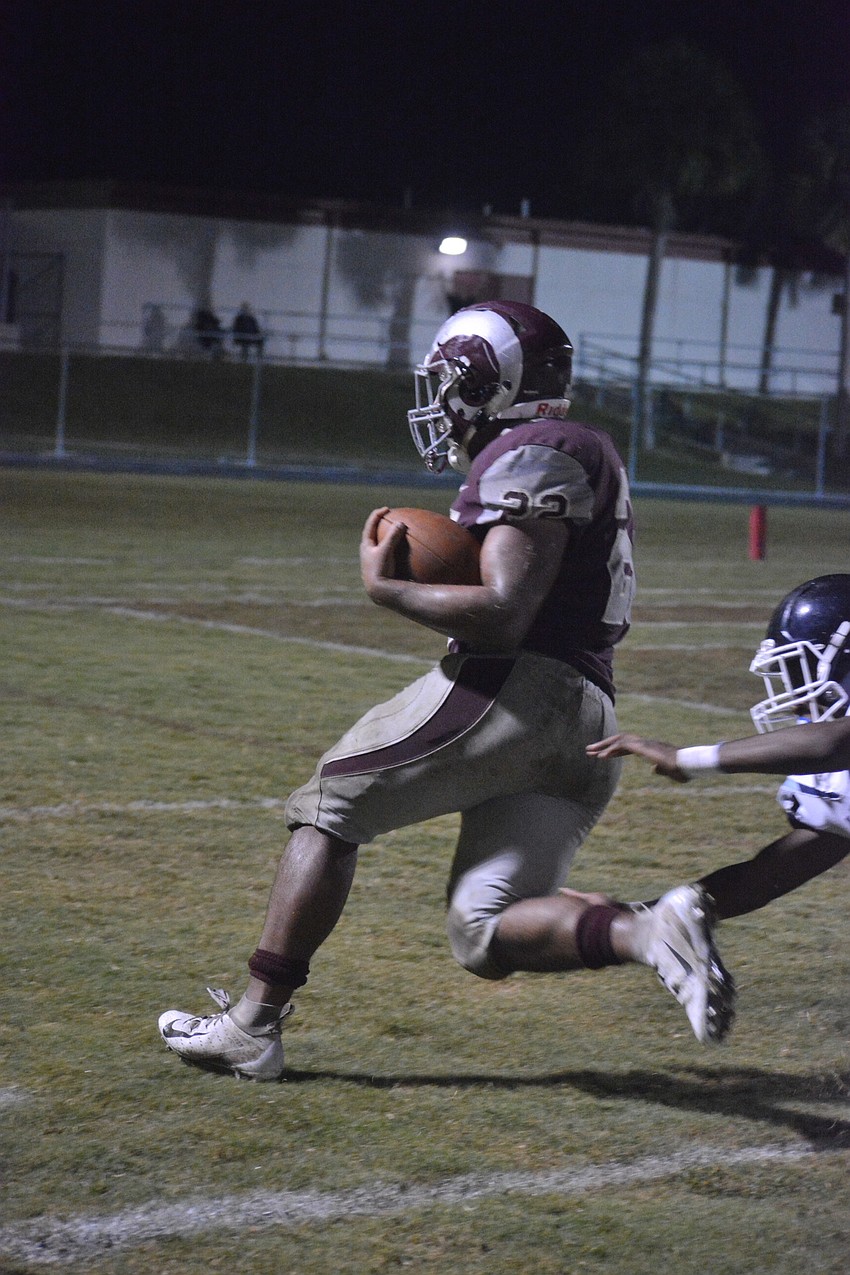 Ali Boyce evades a Panthers defender on his way to the end zone.