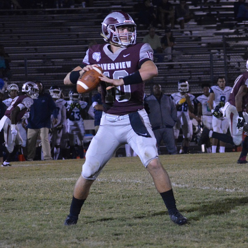 Sean White looks for an open receiver downfield.