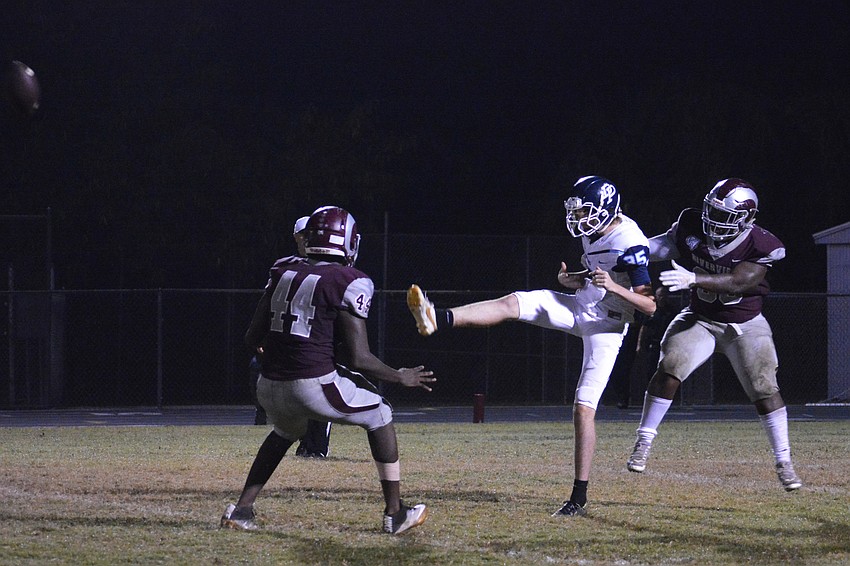 Jarius Brewer and Isaiah Williams force a Dr. Phillips punter to throw the ball away after a bad snap, resulting in an intentional grounding penalty on the Panthers.