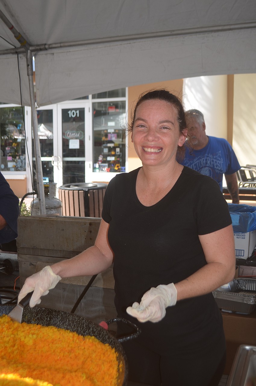 BJ's Concession's Joleen Fein serves up some rice to customers.