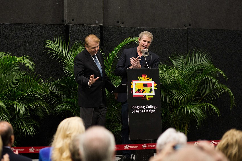 Semkhor Founder and CEO David Shapiro congratulates President Larry Thompson.