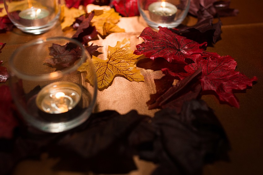 Leaves were scattered on top of the cocktail tables.