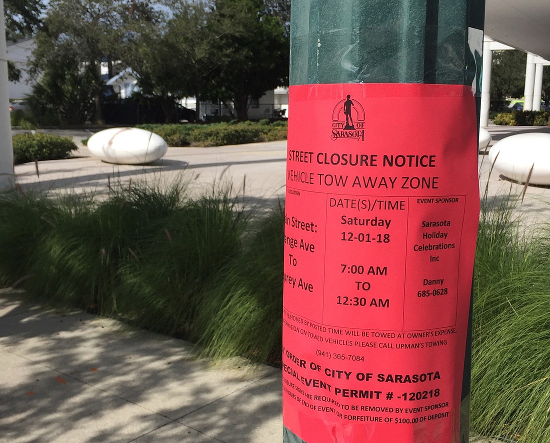 The city posted advisory signs along Main Street about parking restrictions and road closures for Saturday&#39;s parade.