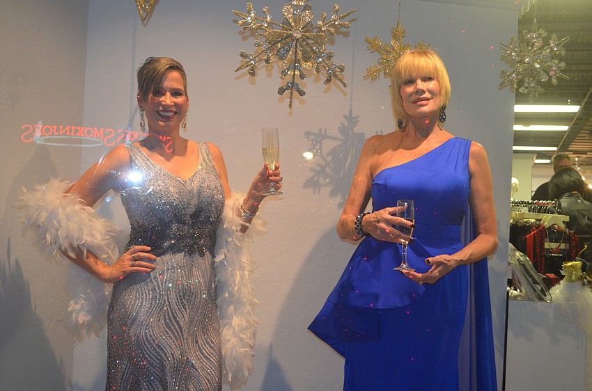 Wendy Rossiter and Vicki Hornberger pose as mannequins at Panache downtown.