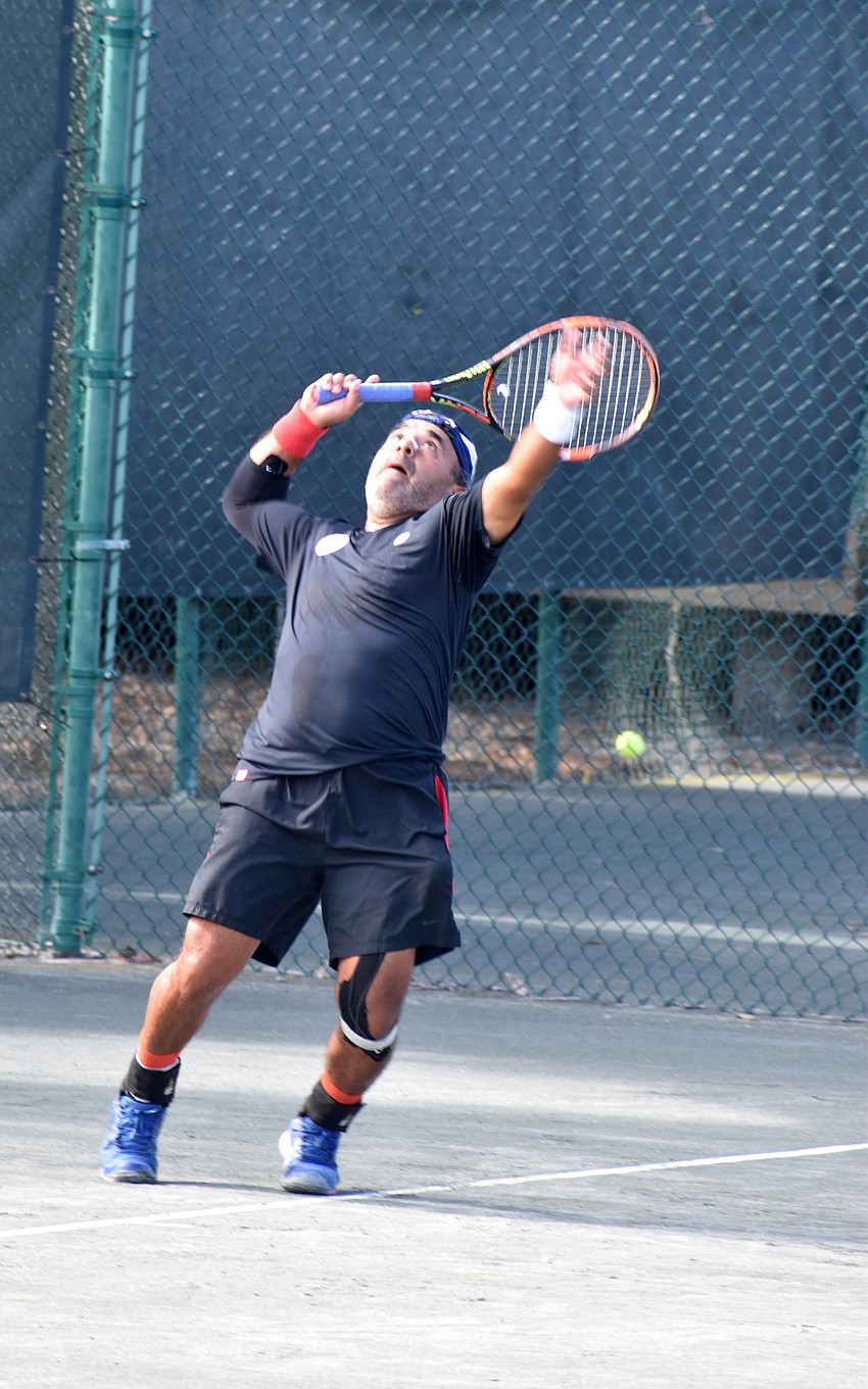 Tomas Blanno serves.