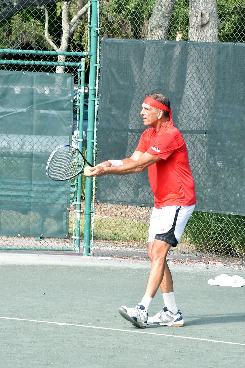Steven Brady prepares to serve to Steve Rosen.