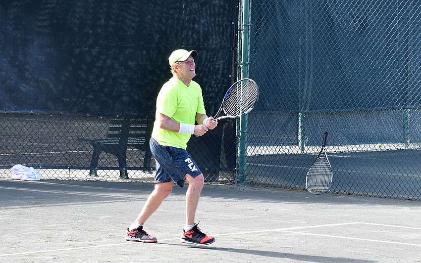 Steve Rosen smiles as he competes against Steven Brady.