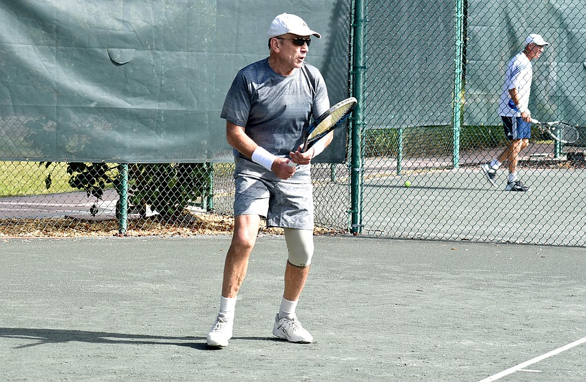 Boris Serebro competes against Van Gladfelter in the Senior Clay Courts tournament.
