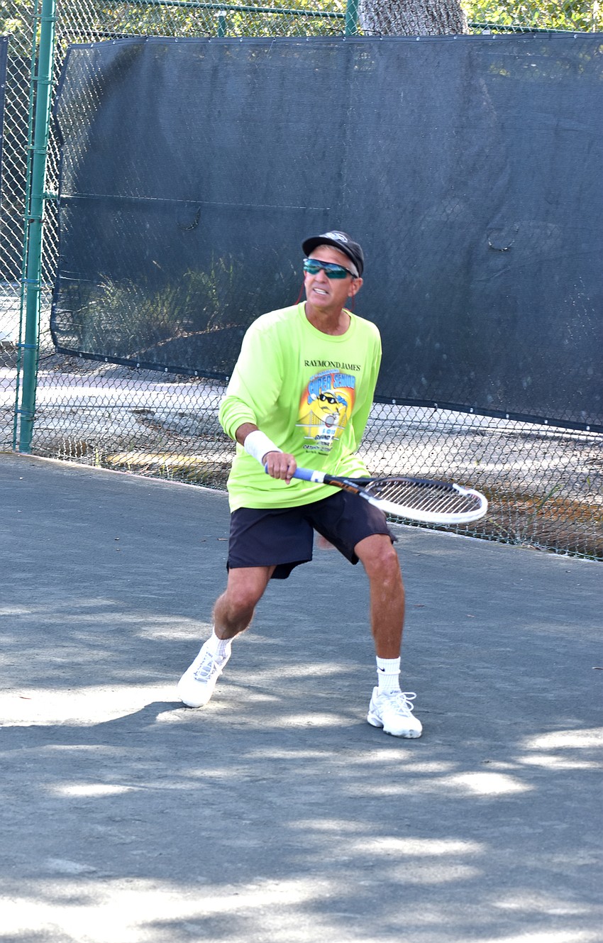 Van Gladfelter runs to return the ball to Boris Serebro.