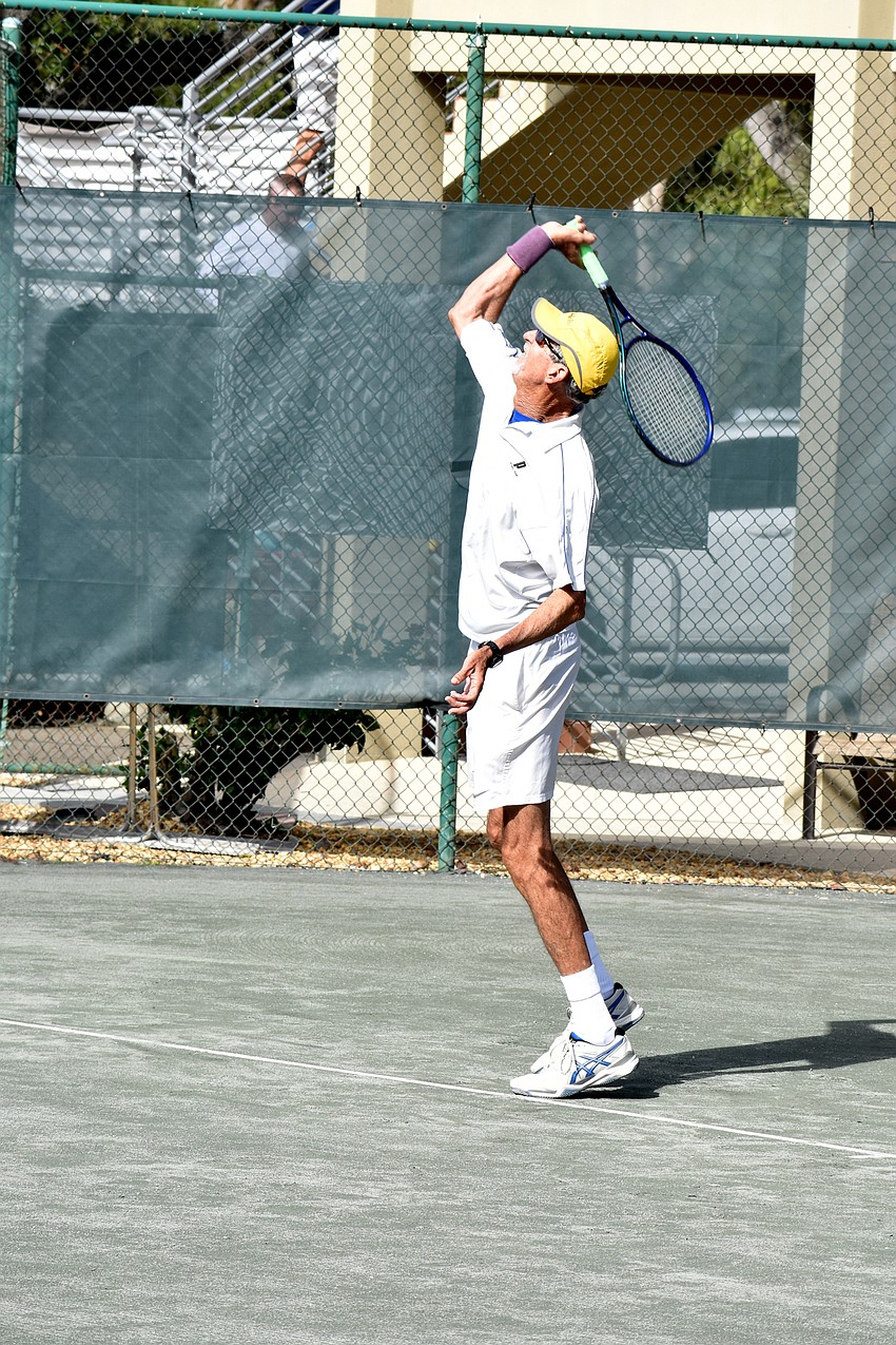 Larry Turville serves the ball during his Friday match against joe Bouguin.