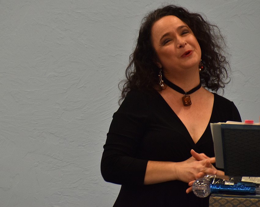 Michelle Giglio sings Christmas songs during an annual concert at St. Mary.