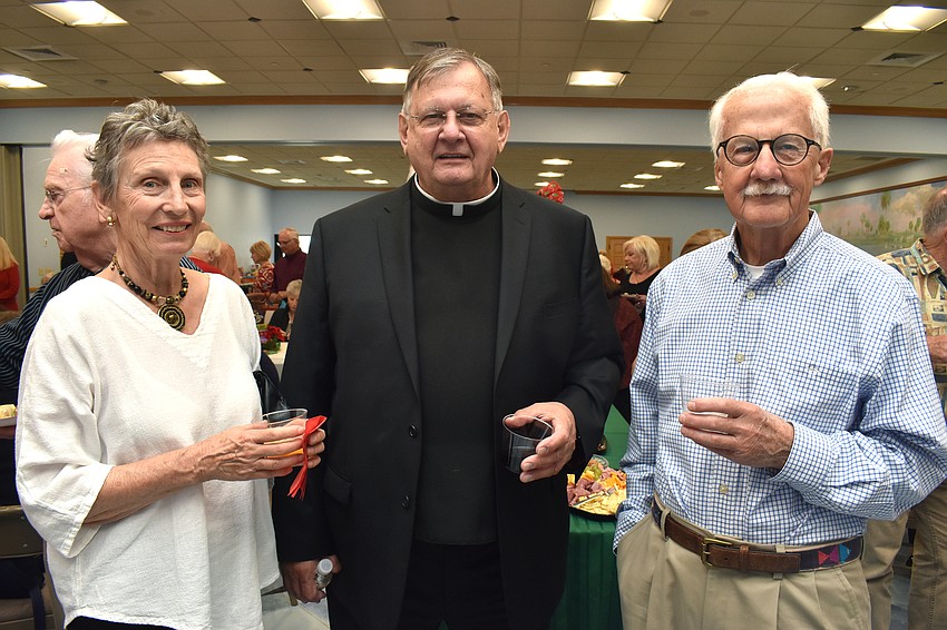 Sherrie Erisman, the Rev. Phil Schweda and Harold Erisman