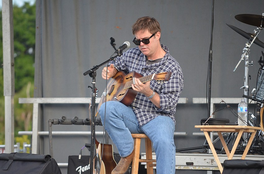 Mike Tozier performs onstage at the seafood and music festival.