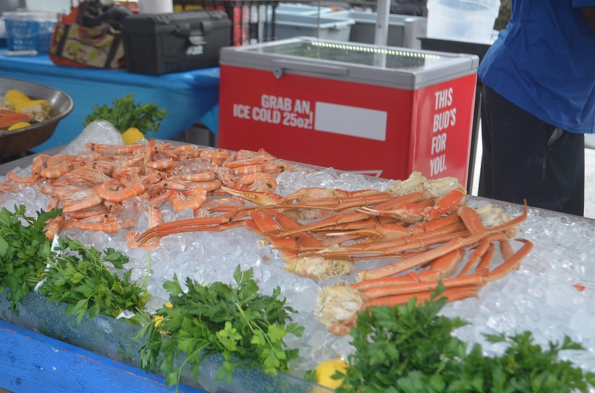 The seafood festival served all kinds of different cuisines like crab legs, shrimp, lobster and crawfish.