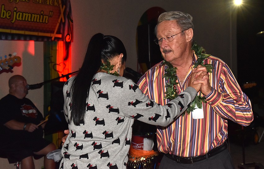 Bill and Maria Buerger dance to live music during the party.