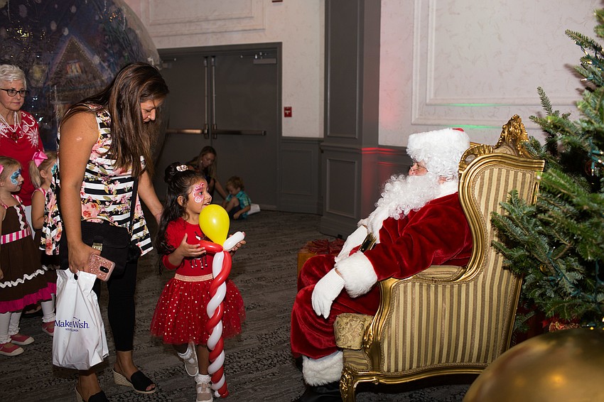 Kids took turns sitting on Santa's lap for a photo opportunity.