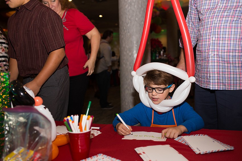 Cameron Hammon writes his letter to Santa.