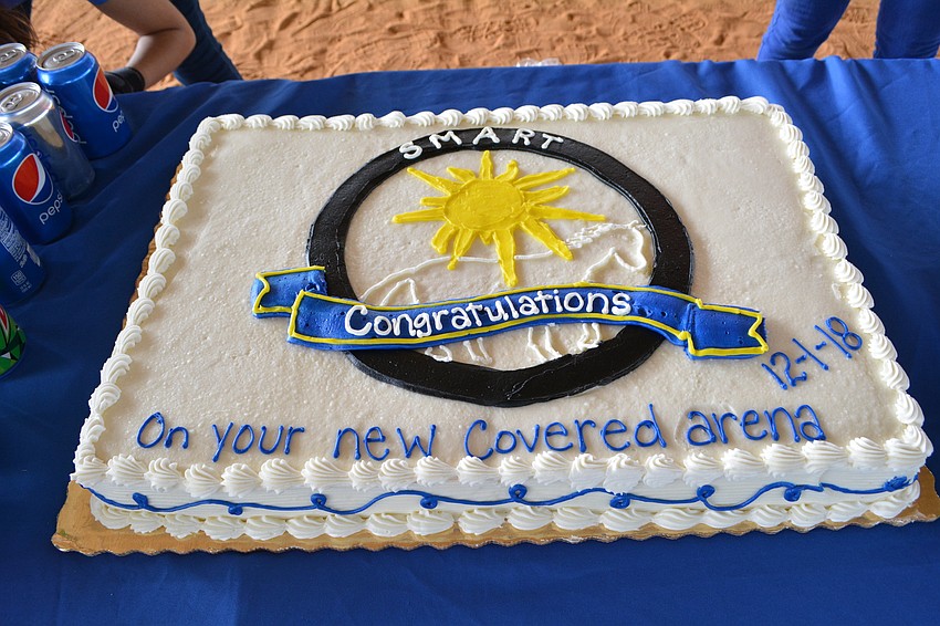 Guests enjoyed cake and other snacks after the ceremony under the new covered arena.