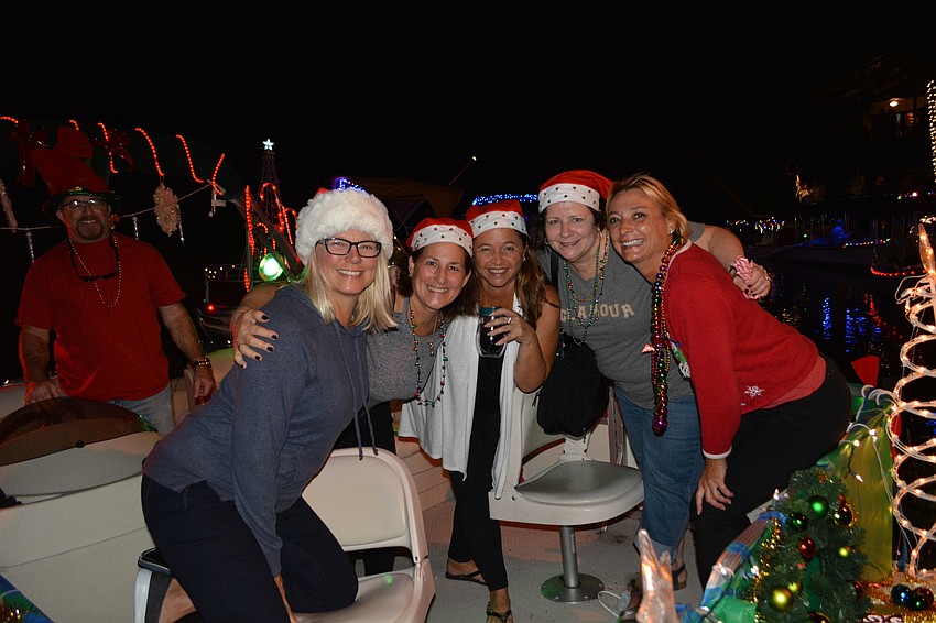 Friends Susan Hampton, Pam Finn, Maria Amenta and Dawn Hanson spent three hours helping Brenda Gradly get her boat ready for the parade.