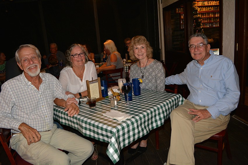 Tara residents Doc and Linda Craig and Sue and Jim Baker dined on the enclosed patio while waiting for the boats to arrive. 