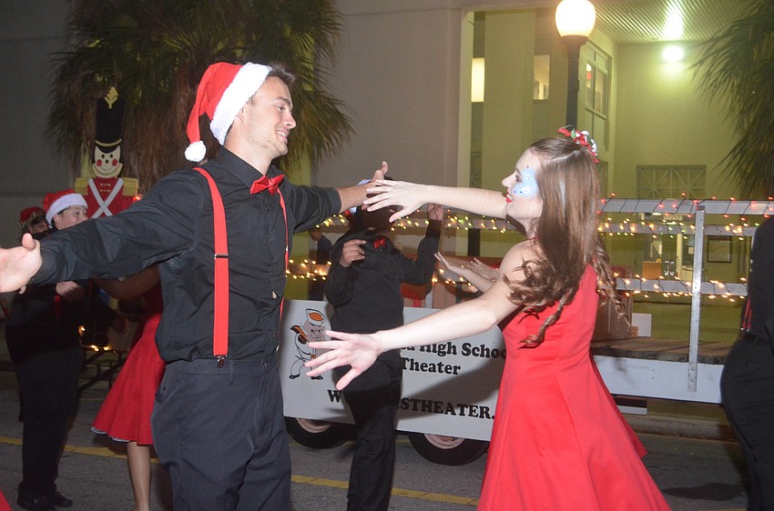 Sarasota High School's Olivia Marquis and James Smith dances with the rest of their school theater group in the parade.