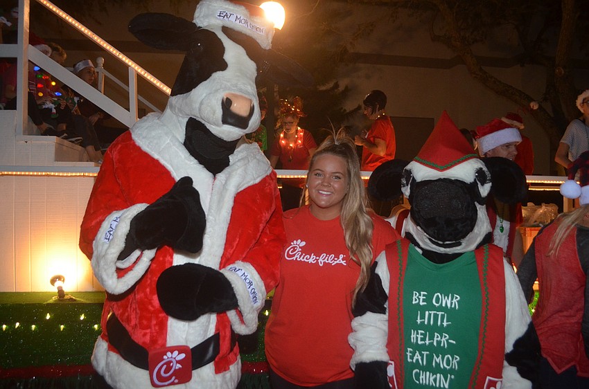 Chick-Fil-A's Katelyn Moeckel poses with the cows.