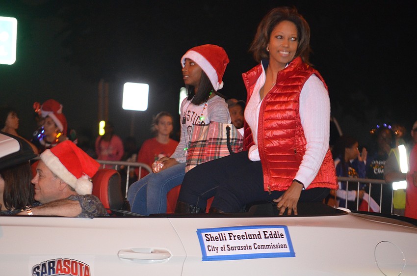Shelli Freeland Eddie, city commissioner, is one of many politicians along the parade route.