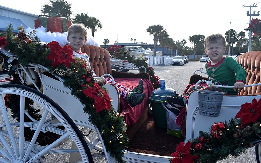Bennett and Weston Rapihana get ready for their carriage ride.