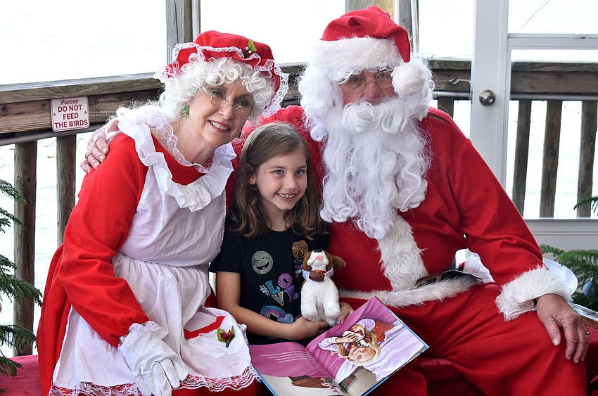Madison King with Santa and Mrs. Claus