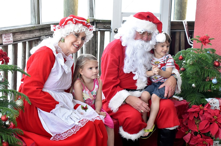 Presley and Michael Scott with Santa and Mrs. Claus