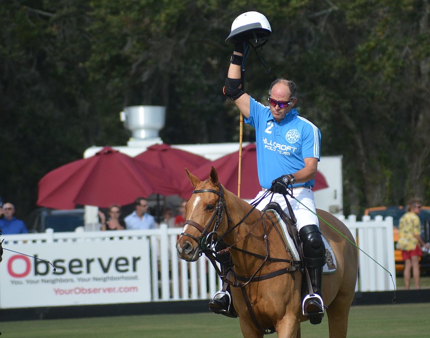 James Miller, the new owner of the Sarasota Polo Club with his wife, Misdee, salutes the crowd just before the season opener begins.