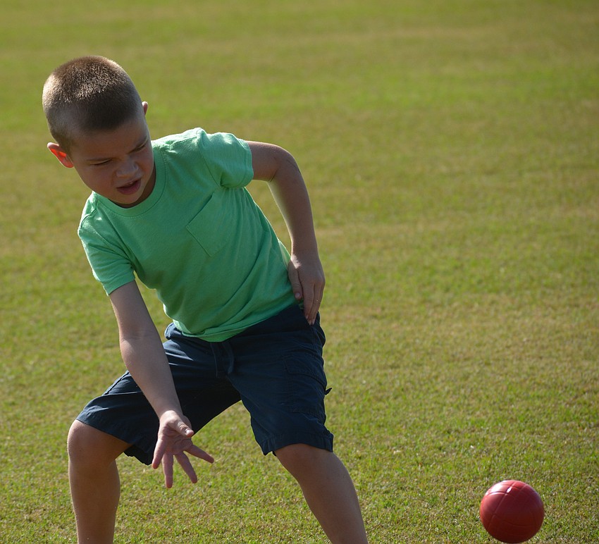 Brayson Kneitzel, 5, of Tidewater Preserve shows you don't need a horse to play on the polo field.