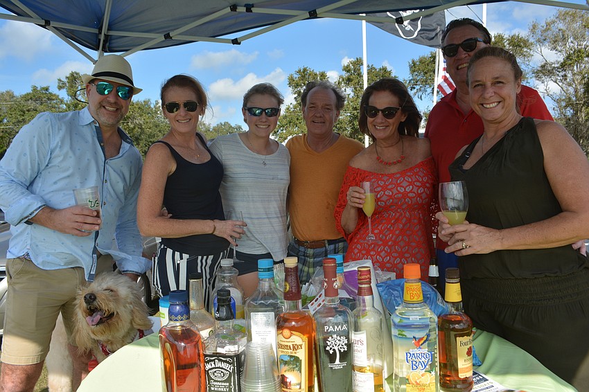 David Liberatore, Michelle Ramsey, Clare Christie, Dana Hanson, Carolyn Perry, Gary Hill and Judy Hanson enjoy some tailgating.