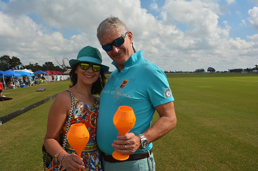 Lakewood Ranch's Marina and Dan Mason brought their orange glasses to the polo season opener.
