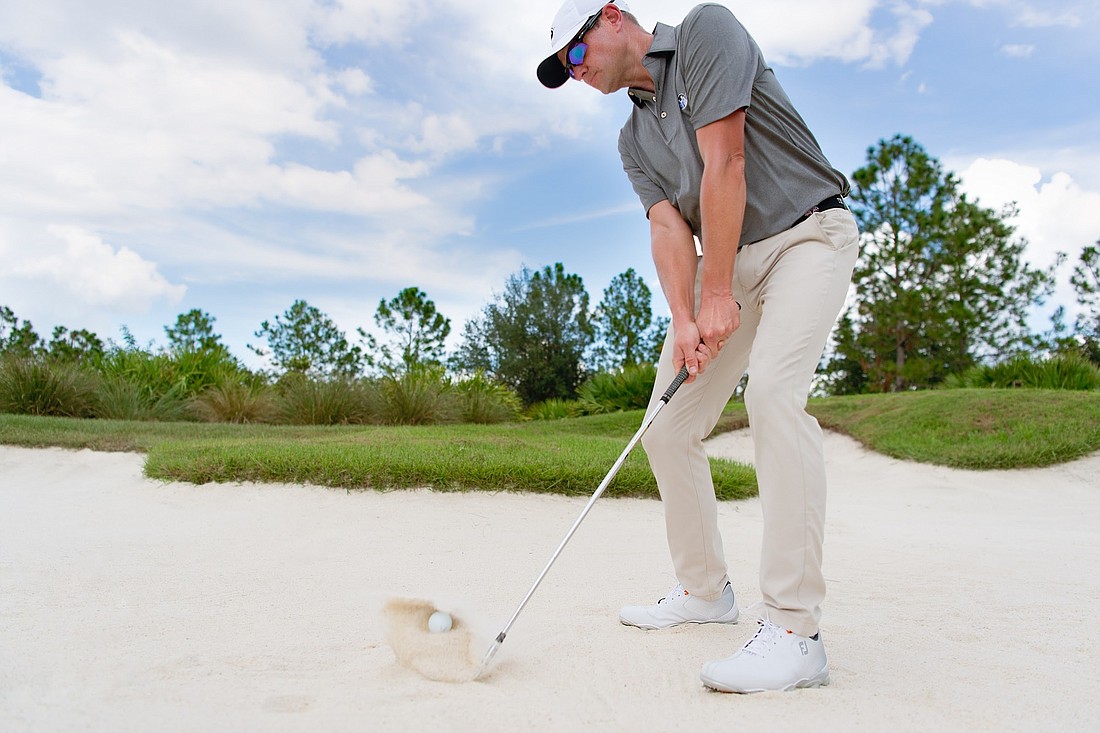 Matt McLean hits out of a bunker at Concession Golf Club. Photo courtesy Jeremiah Khokhar.