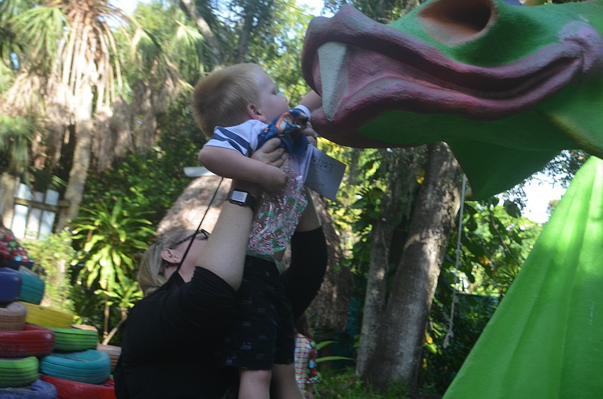William McCombie is given a boost to reach the higher candy canes.