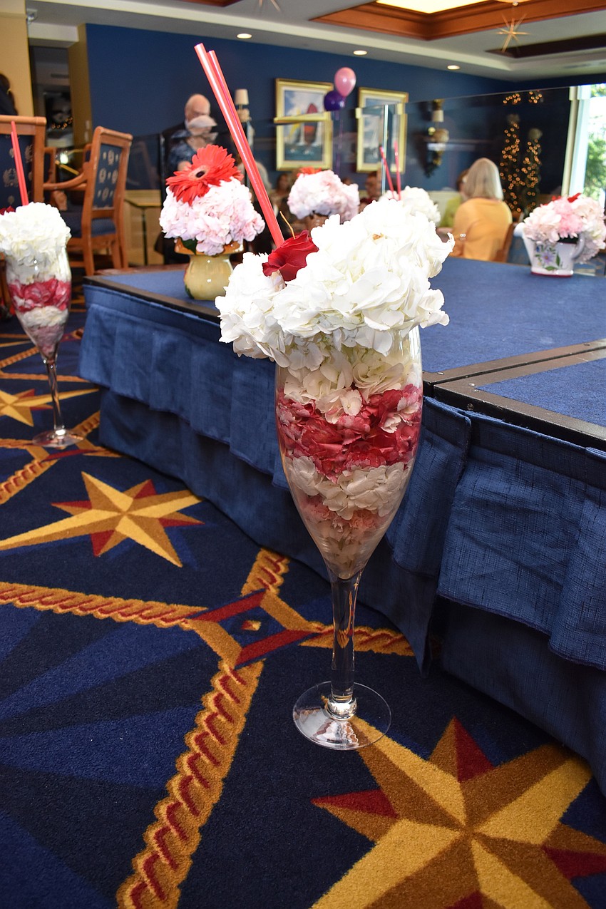 The yacht club dining room was adorned with uniquely shaped flower arrangements.