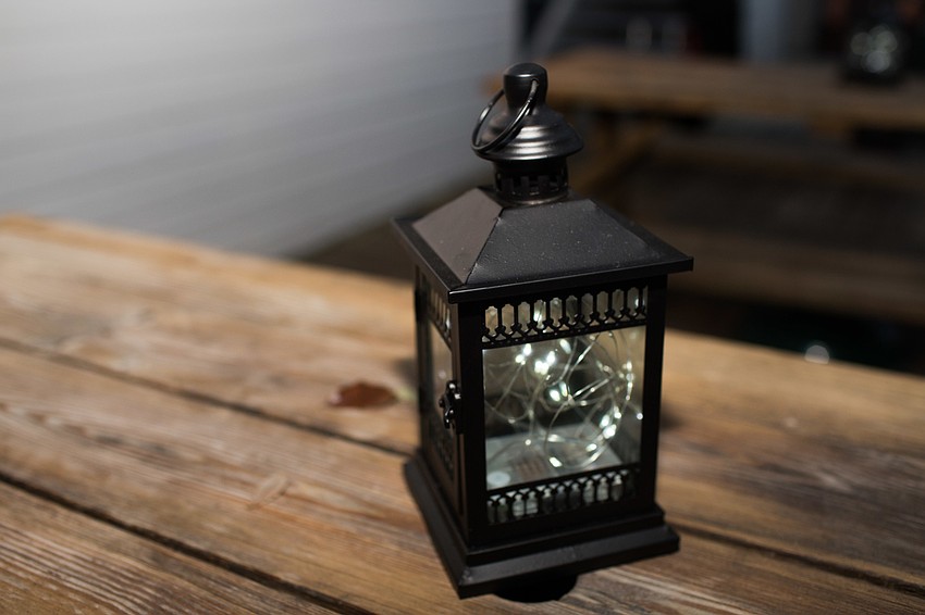Lanterns lit the tables outside.