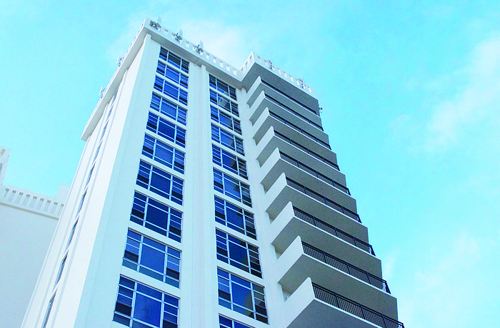 Promenade was built in the 1980s with 112 units on over 6 acres. Its 11 stories is higher than allowed today, as is its density of about 17 units per acre.