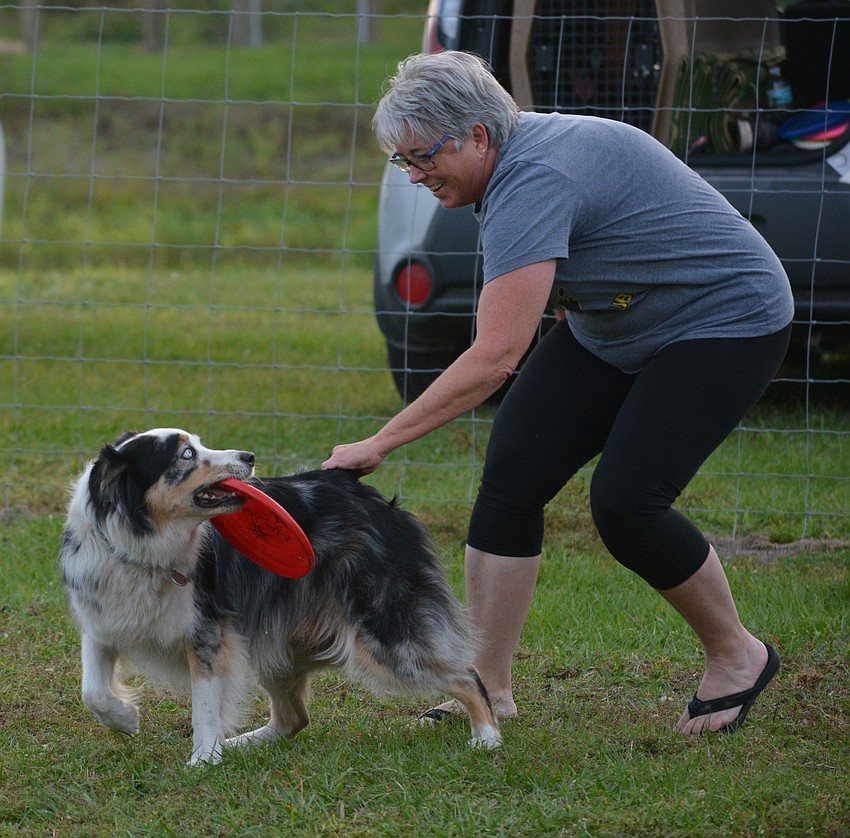Sometimes it can be tough to get a dog to let go of the Frisbee, as Linda Shoenberger finds out.
