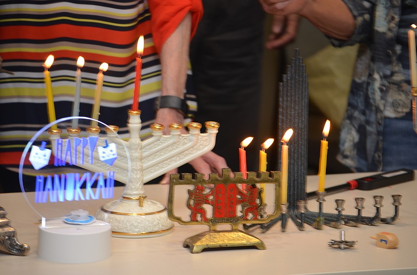 The Menorahs varied in size, shape and style, but the most modern decoration by far was the light-up display proclaiming Happy Hanukah, purchased from Target.